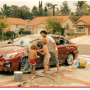 kids washing car with dad