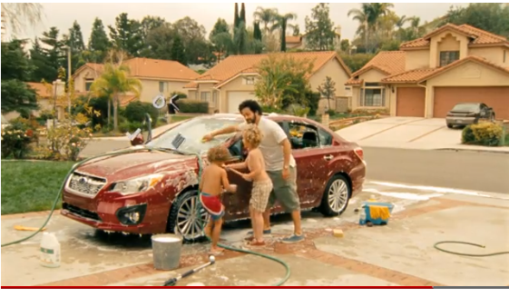 kids washing car with dad